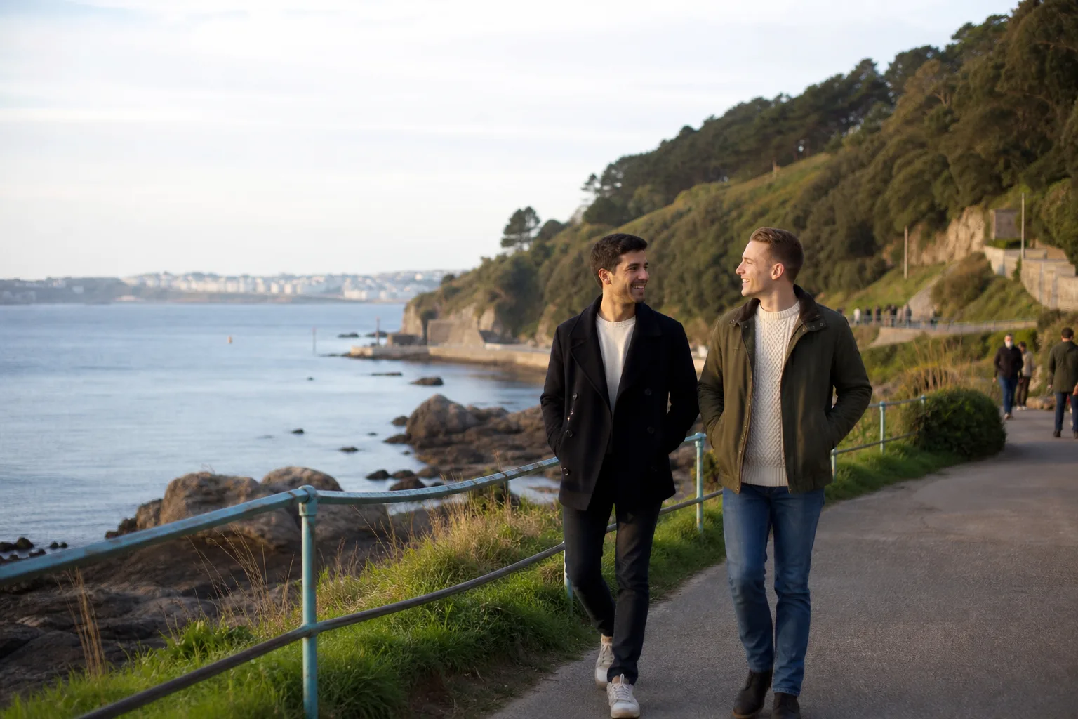 Two men talking beside the waterfront in Plymouth